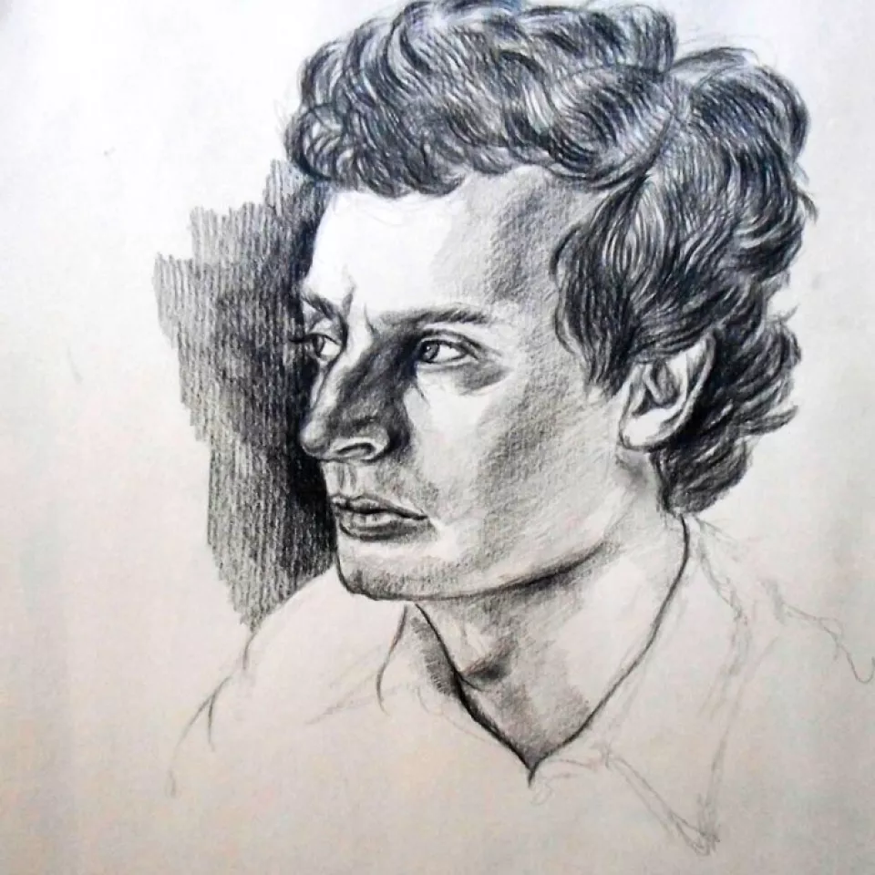 A man looks into the distance.